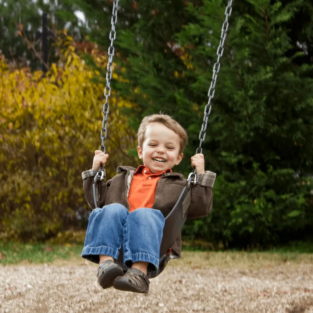 Child on swing - representing joy and healthy family living